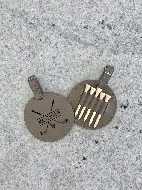 "GOLF TEE HOLDER WITH TEES PERSONALIZED 2.75\" Golf Tees and disc/Strap. laser engraved. 6 options to choose from. DID YOU WANT TO ADD A DELUXE GOLF DIVOT OR BALL MARKER TO YOUR GIFT? https://www.etsy.com/listing/1325938971/golf-gift-golf-divot-and-ball-marker-set?click_key=0ae8ca5bc27f3629c62e0cc4672d7c6641deb7c0%3A1325938971&click_sum=ab4da466&ref=shop_home_active_1&sts=1" Leather Golf Accessories, Golf Swag Bags, Golf Outing Gifts, Golf Club Crafts, Golf Tee Holder, Golf Bag Tags, Personalized Golf Gifts, Golf Wedding, Golf Diy