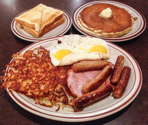 The 'Lumberjack Slam' at Denny's, North Vancouver, BC - Two pancakes, 1 slice of ham, four sausage links, 2 sunny-side-up eggs, hash browns and 2 pieces of toast. Diner Food Breakfast, Lumberjack Breakfast, Dennys Breakfast, Alex Alvarez, Ihop Pancakes, Retro Restaurant, Breakfast Platter, American Breakfast, Sausage Links