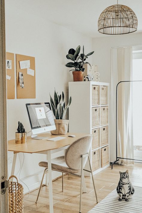 Welcome to my home office. I wanted a space to feel open and fresh but warm and welcoming. The white furniture (ikea dining table come desk) and the pink west Elm chair made the space feel minimal and bright. Using rattan features such as the Kallax rattan storage boxes and the BHS lamp shade And the cork board added the Boho vibe I was looking for and made the space feel cosy and fresh at the same time. Light And Airy Office, Airy Office, One Bedroom Flat, Interior Design Plan, Corporate Office Decor, Dekorasi Kamar Tidur, Small Home Office, Home Office Space, Office Inspiration