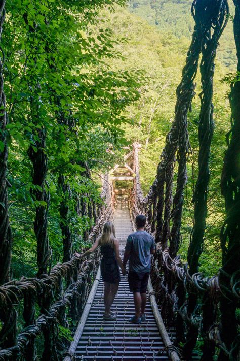 Two people (woman and man) standing on the Oku-Iya Double Vine Bridges in the Iya Valley of Japan. Iya Valley Japan, Japan Map, Tokushima, Bus Terminal, Scenic Beauty, Hot Springs, Public Transport, Osaka, Rafting