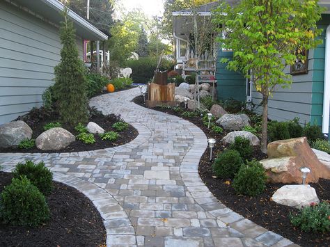 Custom stone pathway between house and garage in Omaha, Nebraska. All work, material and design are from Lanoha Nurseries in Omaha, Nebraska. Featuring boulders, Nebraska trees and custom designed stone pathway built to last through Nebraska winters and summers. Residential Landscaping, Walkway Design, Walkways Paths, Stone Pathway, Rock Garden Landscaping, Backyard Paradise, Stone Path, Patio Landscaping, Patio Stones