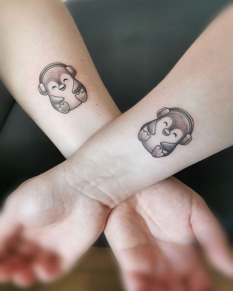 You know you are funky when you sport some cool and creative penguin tattoos! Music Friend Tattoos, Best Friend Penguin Tattoo, Penguin Tattoo Small Couple, Matching Music Tattoos Couples, Cartoon Penguin Tattoo, Music Best Friend Tattoos, Matching Music Tattoos Friends, Couple Tattoos Music, Matching Penguin Tattoos Couples