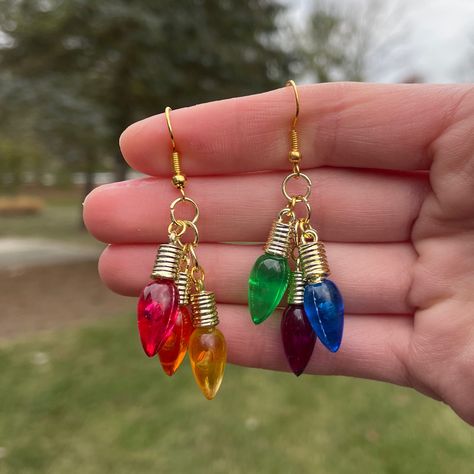 Pair of Clustered Christmas Bulb Dangle Earrings - a larger version of our best selling Mini Christmas Bulb Chandeliers! *Lightweight *Hypoallergenic and nickel free *Handmade   *Super cute and trendy Light Bulb Earrings, Christmas Earrings Diy, Christmas Jewelry Ideas, Christmas Light Earrings, Silly Earrings, Weird Earrings, Bulb Chandelier, Glowforge Projects, Abbott Elementary