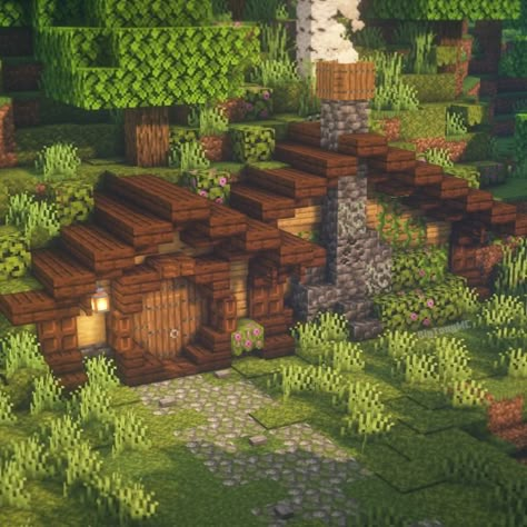 A simple and cozy hobbit hole for your Minecraft world! Hit the link for a tutorial! Minecraft Hobbit Builds, Hobbit Hole House Minecraft, Hobbit Holes Minecraft, Minecraft Underground Base Tutorial, Minecraft Hole Base, Hobbit Hole Minecraft Interior, Hobbit House Minecraft Interior, Minecraft Hobbit Hole Entrance, Hobit Houses Minecraft