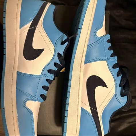 Jordan 1 Low UNC sneakers in black, university blue, and white. Jordan 1 Low Unc, Jordan 1 Low, University Blue, Sneaker Collection, Jordan 1, Jordan, University, Blue And White, Size 10