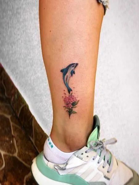 Dolphin Tattoo Designs For Females. Dolphin Tattoo In Memory, Dolphin Tattoo For Women, Dolphin Tattoo Meaning, Dolphin Tattoos, Moose Tattoo, Crocodile Tattoo, Ant Tattoo, Dolphin Tattoo, Starfish Tattoo