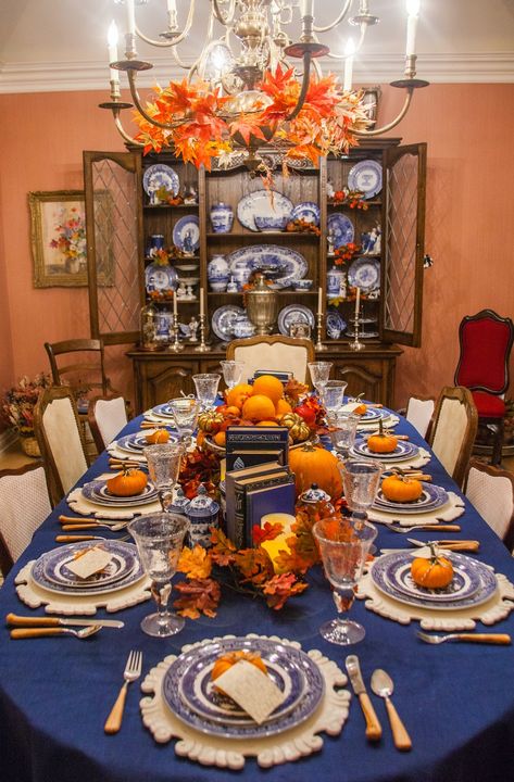 Thanksgiving, Thanksgiving table, Thanksgiving decorating, using books to decorate, pretty in print, delicious reads Blue Thanksgiving Decor, Blue Thanksgiving Table, Thanksgiving Table Inspiration, Blue And White Table Setting, Orange Fall Decor, Blue Thanksgiving, Blue Fall Decor, Blue Table Settings, Pretty Table Settings