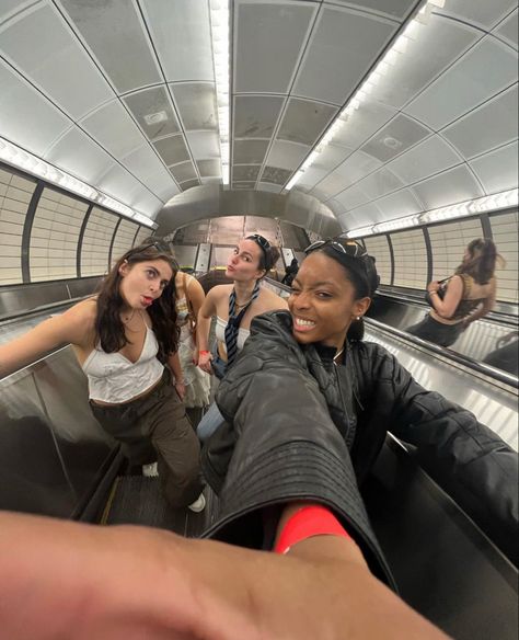 Three stylish friends going off the subway riding escalator in tunnel Subway Photo Ideas, Subway Photoshoot Aesthetic, Nyc Subway Photoshoot, Fisheye Pose, Train Pictures Aesthetic, Escalator Pics, Escalator Photoshoot, Subway Pictures, Subway Pics