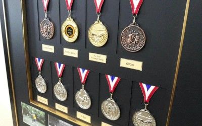 Ways To Display Medals And Ribbons, Display Medals Ideas, Award Wall Display Ideas, Medals Aesthetic, Certificate Wall, Race Medal Displays, Medals Display, Feature Lighting, Art Restoration