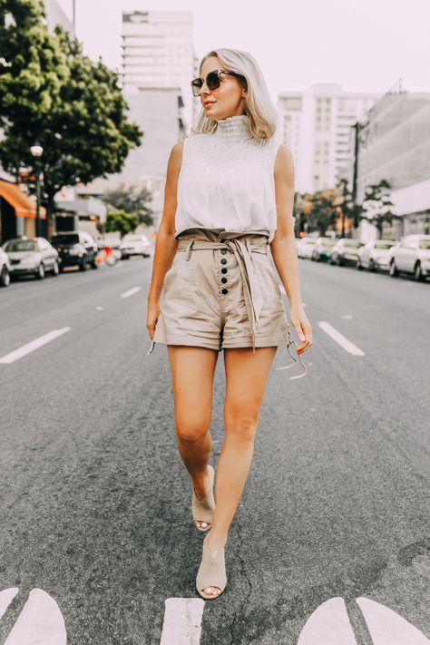 Paper bag shorts, fashion blogger Erin Busbee of BusbeeStyle.com wearing paper bag shorts by Marissa Webb with a white Frame sleeveless high neck top and Vince Camuto peep toe mules in San Diego, CA Bag Shorts Outfit, Paper Bag Shorts Outfit, Erin Busbee, Busbee Style, Midlife Fashion, White Summer Tops, Modest Style, Marissa Webb, Paper Bag Shorts