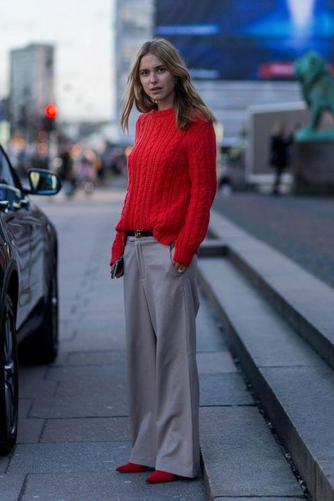 Pernille Teisbaek skips the coat and looks chic for a winter day in wide-leg, slouchy pants and a vivid knit sweater. Click for more fresh winter outfit ideas. Red Sweater Outfit, Grey Pants Outfit, Pernille Teisbaek, Red Knit Sweater, Copenhagen Fashion, Copenhagen Fashion Week, Grey Outfit, Copenhagen Denmark, Malene Birger