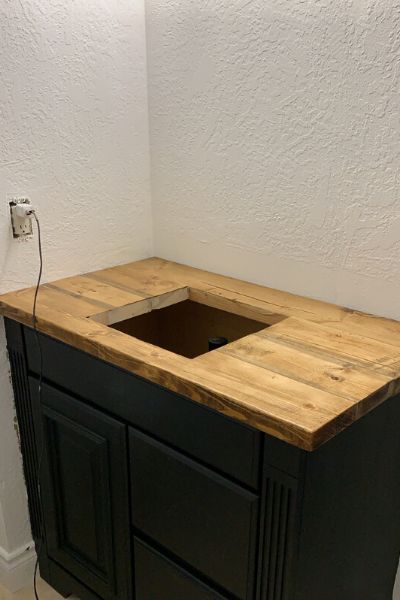 Easy Do It Yourself Vanity Update Diy Wood Countertops Bathroom, Butcher Block Bathroom Vanity Top, Black Bathroom Vanity With Wood Top, Wooden Bathroom Vanity Top, Dark Blue Master Bath, Black Washroom Vanity, Diy Bathroom Vanity Cabinet, Butcher Block Vanity Top Bathroom, Diy Bathroom Vanity Top