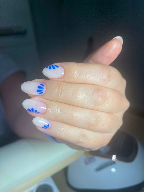 Milky white BIAB mani with blue nail art White And Blue Porcelain Nails, Milky White Nails With Blue Design, Nail Designs With White Base, Nail Designs White Base, Milky White And Blue Nails, Blue And White Almond Nails, White Nails With Blue Design, Milky White Nail Art, Milky Blue Nails