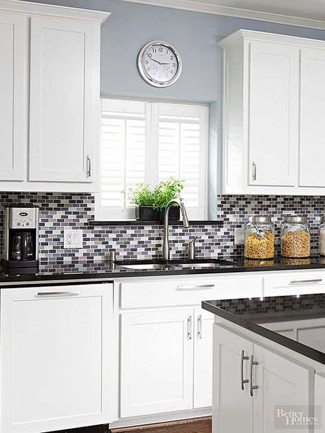 A pop of purple adds subtle color to this gray glass tile backsplash. Kitchen Wall Tiles Backsplash, Glass Backsplash Kitchen, Trendy Kitchen Tile, Trendy Kitchen Backsplash, Kitchen Colours, Kitchen Grey, Trendy Kitchen Colors, Tiles Backsplash, Best Kitchen Cabinets