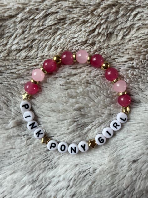 Chappell Roan friendship bracelet - Pink Pony Girl. Pink glass and gold-coloured plastic beads and black and white lettering double strung on 0.5mm monofilament plastic thread. Handmade to order by U.K. based small business. Standard length is 7.5 inches for a roomy fit, if shorter or longer is required please request in personalisation section. Please note if ordering from outside the U.K. additional customs charges may apply which are payable by the buyer and orders can take up to 4 weeks for delivery. Chappell Roan Friendship Bracelets, Chappell Roan Bracelet, Bracket Ideas, Bracelets Kandi, Plastic Thread, Pony Bead Bracelets, Kandi Ideas, Bracelets Design, Kandi Bracelets