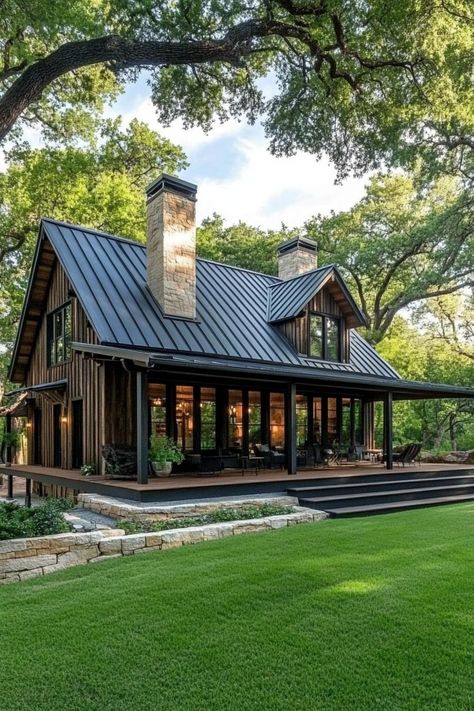 Charming wooden house with large windows and a metal roof. Saddle up your creativity with simple barndominium ideas that blend rustic charm with modern comforts for a home that’s as practical as it is eye-catching. House Metal Siding, Small Lake House Exterior, Metal Building Colors Schemes, Home With Metal Roof, Old Barns Rustic, Simple Barndominium Ideas, Simple Barndominium, House With Large Windows, Rustic House Exterior