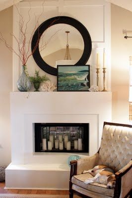 I like the idea of a faux fireplace that has a mirror & candles inside it instead of an actual or electric fire.  I'd use this idea in a bedroom. Tv Above Fireplace, Summer Mantel, Mantle Ideas, Fireplace Mantle Decor, Fireplace Mantel Decor, Room With Fireplace, Mirror On The Wall, Faux Fireplace, Fireplace Mantle