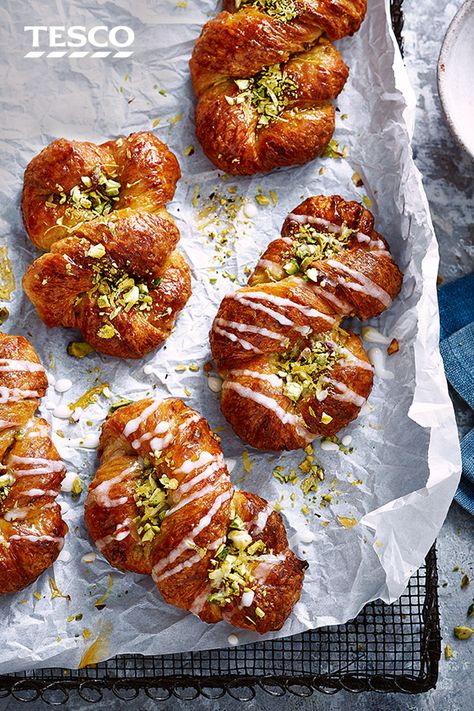 Enjoy an indulgent breakfast with this delicious pistachio pastry recipe. A twist on a classic Danish pastry, this version has flaky, enriched dough, fragrant pistachio filling and sticky lemon icing. | Tesco Sweetmeat Recipes, Lemon Danish, Pistachio Pastry, Pastry Treats, Danish Pastries, Tesco Real Food, Lemon Icing, Danish Pastry, Recipes Baking