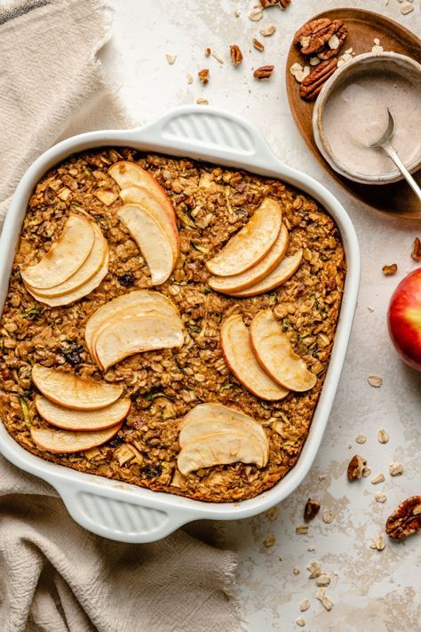 Wonderful apple zucchini baked oatmeal filled with cozy spices and drizzled with a light cinnamon vanilla glaze. This protein-packed zucchini apple baked oatmeal is freezer-friendly and the perfect breakfast for transitioning from summer to fall! Add nuts and raisins for the ultimate breakfast treat. #breakfast #bakedoatmeal #oatmeal #zucchini #apple #mealprep #healthybreakfast Zucchini Baked Oatmeal, Oatmeal Zucchini, Apple Baked Oatmeal, Apple Zucchini, Zucchini Oatmeal, Spiced Zucchini, Breakfast Oatmeal Recipes, Perfect Healthy Breakfast, Good Morning Breakfast