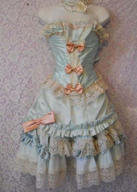 A gorgeous pale pale powder blue satin tulle and lace outfit hand made by vintage opulence on Etsy In palest powder blue satin with a tulle underskirt and oodles of ruffles, pleats and lace trims Finished with three hand made pink satin bows and a larger bow on the skirt Custom made to your measurements Can be made in any colorway Please allow 2-3 weeks for completion Pink Marie Antoinette, Marie Antoinette Dress, Marie Antoinette Dresses, Ropa Shabby Chic, Vintage Opulence, Antoinette Dress, Rococo Fashion, Woodstock Ga, Costume Ball