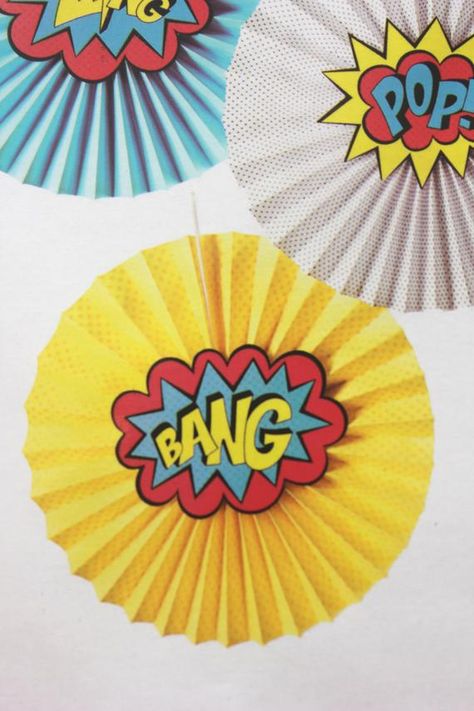 Set of 5 Superhero theme Paper Fans Includes Superhero theme colors and cutouts with popular phrases Kapow, Bang, Zing, Pop, and Boom to add on top Fans ship flat- simple assembly required. Great for your Super Heros party! Larger quantities and matching accessories available-please see our other Spiderman Decor, Spiderman Decorations, Superman Party, Superman Spiderman, Superhero Classroom Theme, Marvel Party, Superman Birthday, Avenger Birthday Party, Super Hero Theme