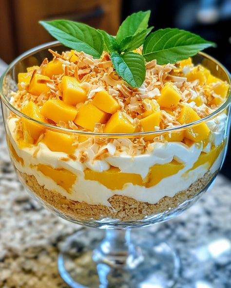 "This Mango Coconut Trifle is a fruity delight that brightens up any day. You'll want to make this again and again!  I’ve been making this Mango Coconut Trifle for years, and every time I serve it, my guests can’t get enough! The layers of creamy coconut and fresh mango are just irresistible.   Ingredients: - 2 ripe mangoes, diced - 1 cup coconut milk - 1 cup whipped cream  For the complete recipe and other ingredients, Link in first comment [👇] [👇]  Give this delicious dessert a try, and you’ll see smiles all around!   #MangoTrifle #CoconutDelight #DessertLovers #EasyDessert #FruitTreat" Coconut Trifle, Mango Coconut, Trifle, Coconut Cream, Family Favorites, Easy Desserts, Coconut Milk, Whipped Cream, Delicious Desserts