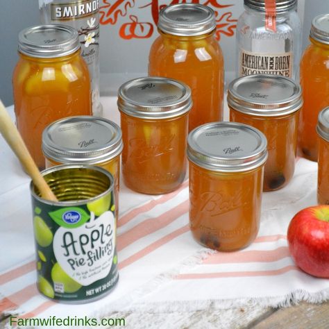 Apple pie moonshine combines apple cider and juice with apple pie filling with cinnamon sticks and vanilla with moonshine and vanilla vodka to create your new favorite fall liquor to drink. #Moonshine #AppleRecipes #ApplePie #Vodka Caramel Moonshine, Peach Pie Moonshine, Flavored Moonshine Recipes, Moonshine Drink Recipes, Apple Pie Moonshine Recipe, Sweet Tarts Candy, Vodka And Pineapple Juice, Apple Pie Moonshine, Homemade Alcohol