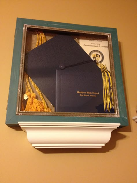 Found a perfect shadow at Home Goods for $16.99 that fits all my graduation goodies in it to display in my room! ...Instead of putting it in a box in the top of my closet! Jrotc Shadow Box Ideas, Graduation Cap Display, Graduation Frame Display, College Graduation Shadow Box Ideas, Cap And Gown Shadow Box Ideas, Graduation Shadow Box Ideas High School, Diploma Display Ideas, Graduation Shadow Box Ideas, Graduation Shadow