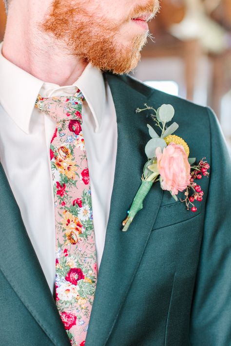 Jack decided to ditch the classic black tie and opt for one that was covered in the flowers that were a part of the rest of their wedding. Follow our social media for more of Katie and Jack's dreamy wildflower wedding! IG: @maurajanesphoto | Website: maurajanephotography.com Groom Wildflower Wedding, Wild Flower Groomsmen, Colorful Wedding Outfit Men, Groom Floral Shirt, Whimsical Groomsmen Attire, Groom Attire Garden Wedding, Men’s Wedding Looks, Wildflower Wedding Suit, Wildflower Wedding Groom Suit