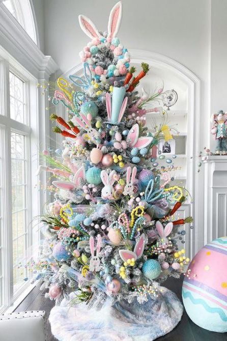 This Easter tree is an explosion of color. Dress up a flocked artificial tree for spring by tucking faux egg branches and pastel beads into the boughs. Add a few stuffed bunnies, pastel ornaments, and paper carrots for a colorful mix. #eastertree #eastertreeideas #easterdecorations #bhg Branches Vase, Easter Tree Ideas, Easter Tree Diy, Diy Tree Decor, Easter Tree Ornaments, Easter Egg Tree, Easter Craft Decorations, Spring Decoration, Easter Tree Decorations