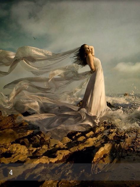 Girl on a rock by the sea flowing dress Surrealistic Photography, Poses Modelo, Graphic Designer Job, Contemporary Costumes, Blowing In The Wind, Concept Photography, Wind Of Change, Surreal Photos, Fairytale Photography