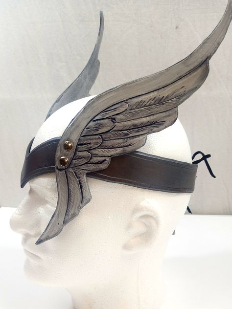 This unique crown features tooled leather wings on each side, making a great valkyrie or fantasy costume accessory. Available in silver or gold tones. Circlet measures 20 inches long and finishes in the back with an eyelet for easy adjustability. Additional styles of crowns and cuffs are also available - take a look at my additional available items! Your leather crown will be shipped first class within three weeks. Steampunk Viking, Valkyrie Costume, Greek God Costume, Winter Cloak, Viking Cosplay, Leather Crown, Diy Wings, Steampunk Hat, Armadura Medieval