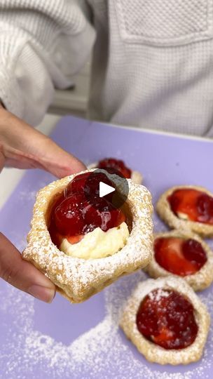 288K views · 4.1K reactions | Your family will love this easy dessert | Your family will love this easy dessert

I use puff pastry, cheesecake and strawberries to make an easy treat. | By Justine Kameron | You're going to love these easy
sweet treats. We're starting off with our puff pastry shells
and we're going to just place them on our sheet pan and bake
them to the box instructions. Once they're fully cooked,
we're going to remove the centers from them so that we
have a hollow shell and then we're going to go ahead and
grab our no bake cheesecake. I love this stuff. We're going to
add a scoop of our no baked cheesecake into each of our
puff pastry shells and then of course top this off with some
strawberry pie filling. Add a scoop of pie filling to each of
the shells. Such an easy and Puff Pastry Cheesecake Bites, Filling For Puff Pastry Shells, Puff Pastry Shell Dessert, Fruit Filled Puff Pastry, Puff Pastry Cupcake Pan, Strawberry Cheesecake Puff Pastry, Justine Kameron Cooking Dessert, Old School Desserts, Strawberry Puff Pastry