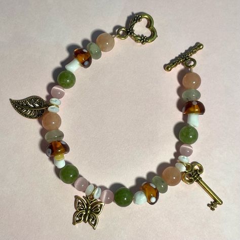 Lavender Land Jewelry | Butterfly Forest bracelet 🔑🍄🤎 7 and a half inches in length Available now on our website! - - - #jewelry #butterflyjewelry #bracelet #s… | Instagram Fairycore Bracelet, Butterfly Forest, Cottagecore Coquette, Cottagecore Jewelry, Bday List, Fairycore Cottagecore, Kandi Ideas, Jewelry Butterfly, Bracelet Inspo