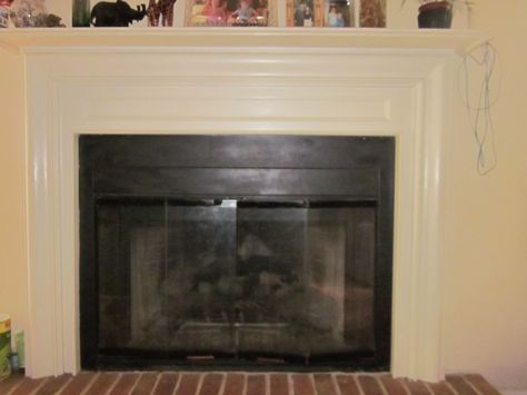 Updated Fireplace Doors- 2 coats of special black paint over bronze finish Painting Fireplace Doors Black, Update For Honey Oak Surround Fireplace, How To Paint Fireplace Doors, Painting Fireplace Insert Black, Spray Paint Fireplace Insert, Glass Fireplace Doors, Updated Fireplace, Painting Fireplace, Prefab Fireplace