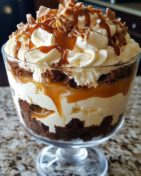 🍫🍮 Caramel Cheesecake Brownie Trifle Delight Ingredients: For the Brownies: 1 box brownie mix (plus ingredients listed on the box) For the Cheesecake Layer: 8 oz cream cheese, softened 1/2 cup powdered sugar 1 teaspoon vanilla extract 1 1/2 cups whipped topping For the Caramel Sauce: 1/2 cup caramel sauce (store-bought or homemade) For Assembly: 1/2 cup chocolate chips or shavings (optional for garnish) Whipped cream (optional for topping) Instructions: Prepare Brownies: Bake the brow... Caramel Cheesecake Brownie Trifle, Brownie Cheesecake Trifle, Brownie Cake Ideas, Brown Foods For Color Party, Brownie Trifle Recipes, Brownie Triffle, Caramel Trifle, Cheesecake Deserts, Homemade Baking Powder