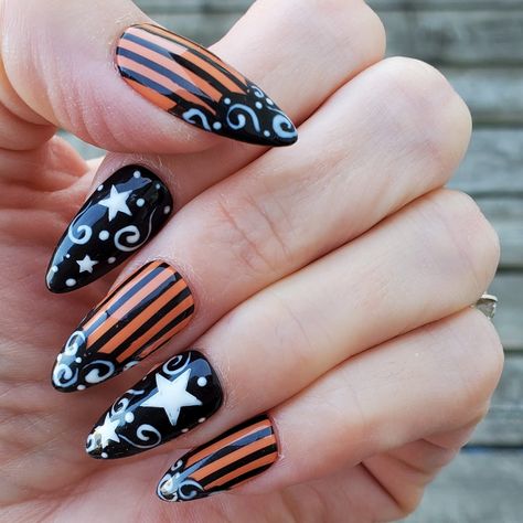 Cute orange, black and white swirl, stripe and stars Halloween press on nail set. Shown here in short almond shape/length - gloss finish. Our gel press on nails are made by a nail technician using high quality, professional ONLY products and are priced accordingly. All orders come with an application kit that includes: file, buffer, alcohol wipes, cuticle pusher, sticky tabs and glue. A Sizing kit is HIGHLY recommended as sizing varies from each tip manufacturer. Sizing kits are available to pur Holloween Nails Almond, Halloween Orange And Black Nails, Neon Short Nails Designs, Vintage Halloween Nail Art, Vintage Halloween Nails, Black And Orange Halloween Nails, Orange And Black Nail Designs, Halloween Nails Orange, Orange And Black Nails