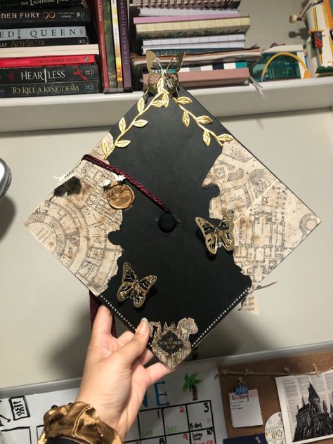 Museum Graduation Cap, Noah Kahan Grad Cap Ideas, Graduation Cap Designs Book Theme, Hunger Games Grad Cap, Grad Cap Music Ideas, Interior Design Grad Cap, Senior Hats Decoration, Graduation Cap Designs History, Graduation Cap Designs No Words