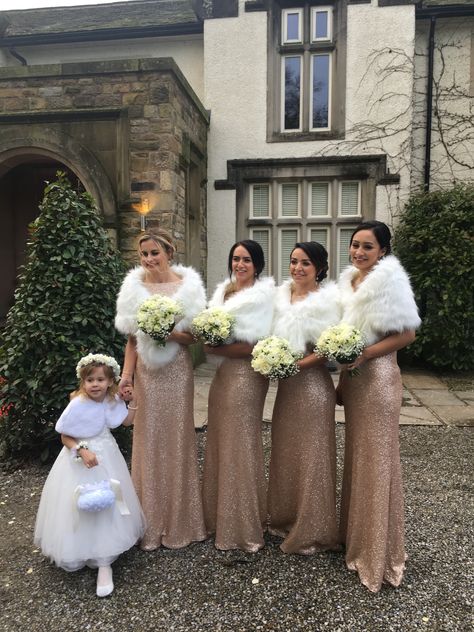 Sequin bridesmaid dresses + faux fur shawls are the perfect winter wedding combo! Winter Wonderland Wedding Bridesmaids, Gold Bridesmaid Dresses Winter, Wedding Fur Shawl, Bridesmaid Winter, Winter Wedding Fur Shawl, Winter Wonderland Wedding Theme, Gold Sequin Bridesmaid Dress, Wonderland Wedding Theme, Winter Wedding Fur