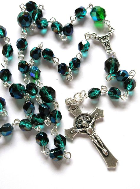 This Lutheran rosary is made with 6mm and 8mm dark emerald green Czech AB faceted rounds. An Italian made oxidized silver crucifix was used. The connector is silver plated pewter. I hand turned the silver plated wires. The rosary is about 21 inches around and has a 4.5 inch cross drop. There are 6 sets of 6 beads with an additional larger bead to each set which follows the Longworth Lenten pattern. It will be slipped into a velvet bag and shipped in a bubble mailer. Green Rosary, Beautiful Rosaries, Dark Emerald Green, The Rosary, Bubble Mailer, Velvet Bag, Oxidized Silver, Czech Beads, Prayer Beads