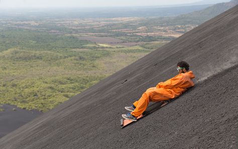 You Can Go Sandboarding Down an Active Volcano in Nicaragua | A climbing and sandboarding adventure is the best way to experience Cerro Negro and will be one of the many highlights of your Nicaragua holiday. Swimming With Dolphins, Best Bucket List, Nicaragua Travel, Sand Surfing, Active Volcano, Conde Nast Traveler, Winter Vacation, Group Tours, The Atlantic