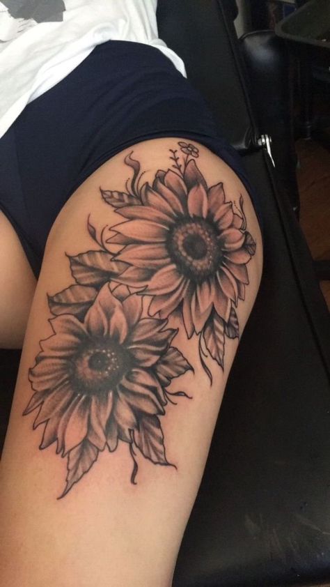 sunflowers-thigh-tattoos-black-shorts-white-t-shirt-black-leather-bed Tattoo Of Sunflowers, Sunflower Tattoo On Thigh, Theigh Tattoos, Thigh Sleeve Tattoo, Sunflowers Tattoos, Thigh Piece Tattoos, Sunflower Tattoo Thigh, Tato Paha, Sunflower Tattoo Sleeve