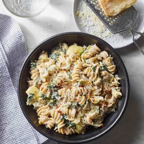 This spinach and artichoke dip pasta takes just 20 minutes to prepare. Learn how to make this creamy pasta recipe for an easy weeknight dinner. Artichoke Dip Pasta, High Protein Dinner, Pasta Cremosa, Creamy Pasta Recipes, Protein Dinner, Spinach Artichoke Dip, Artichoke Dip, Spinach Artichoke, Creamy Pasta