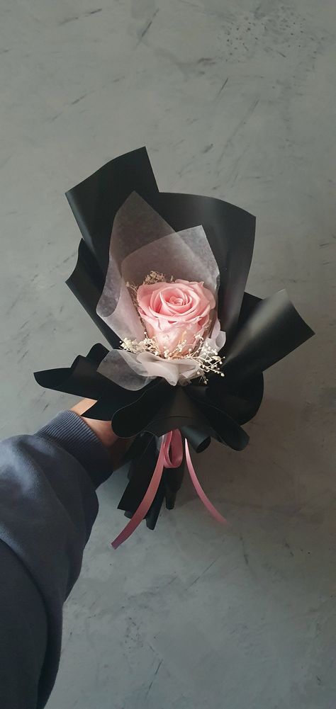 A single light pink rose with baby's breath wrapped in two different types of textured paper with a beautiful silk ribbon. The wrapping paper will be consisting mostly of black and then a coloured or white wax paper to allow the rose to stand out. The ribbon will match the existing rose.  This will make a great gift for any and all occ asions whether a birthday, anniversary, Mother's Day or simply any reason. More rose colours are to come over time. These flowers are made to last forever, or in Minimal Birthday Decor For Men, Light Pink And Black Outfit, Flowers For Men Gift Man Bouquet, Flower Bouquet For Men, Bouquet For Men, Flower Core, Single Roses, Pink Roses Bouquet, Flower Keepsake