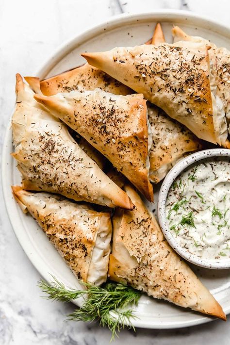 ​These individual Spanakopita Triangles from Plays Well with Butter are a hearty, satisfying, & modern twist on the traditional Greek dish we all know & love. Spanakopita Triangles, Spanakopita Recipe, Greek Dinners, Spinach Feta, Lamb Meatballs, Greek Dishes, Party Appetizer, Artichoke Hearts, Spinach And Feta