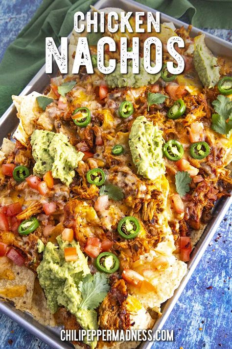 These are the best chicken nachos loaded with juicy, saucy shredded chicken, melty cheese and salsa con queso for extra cheesiness, and all the toppings! Chicken Cheese Nachos, Nachos With Chicken And Cheese, Chicken And Cheese Nachos, Best Chicken Nachos Recipe, Chicken For Nachos, Mexican Chicken Nachos, Creamy Chicken Nachos, Mexican Nachos Recipe, Shredded Chicken Nachos