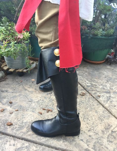 DIY Pirate Boots made by upcycling a boring pair of knee high boots from the thrift store with homemade fold over boot toppers (or boot cuffs) - material was a flat finish pleather or vinyl found in the clearance bin. I added a front pleat to make the front pop out, and added two gold buttons on the outer sides for a real pirate feel! I’ll be posting a step by step tutorial on my blog very soon. #diypiratecostume #diypirate #pirate #piratecostume #diypirateboots #pirateboots Diy Pirate Accessories Ideas, Pirate Boots Diy, Diy Pirate Coat, Diy Pirate Boots Covers, Pirate Boot Covers Diy, Pirate Costume Sewing Pattern, Pirate Pattern Sewing, Captain Hook Halloween Costume, Pirate Vibes