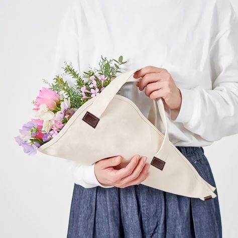 Give a lovely, sustainable gift for any occasion! No more plastic wraps on your floral bouquets; wrap them in all natural, sustainable linen. This unique, reusable flower tote holds bouquets, herbs, and anything beautiful from your garden! Perfect for giving flowers as a gift, and for special occasions like mothers day, valenties day, bridal showers, baby showers and weddings. Linen is naturally anti-microbial, so you don't have to worry about smells and stains, and the pre-shrunk tote can be tossed in the washing machine and re-used! You can also print any logo or word you want, as it is customizable. Cotton Flower Bag %100 Cotton HandMade Flower Bag Flowers not included. I hope you carry happiness! Pitanecastle Flowers As A Gift, Valentines Gift Wrap, Bouquet Bag, Giving Flowers, Bouquet Holder, Flowers Tote, Reusable Gift Bags, Cotton Flower, Gift Bouquet