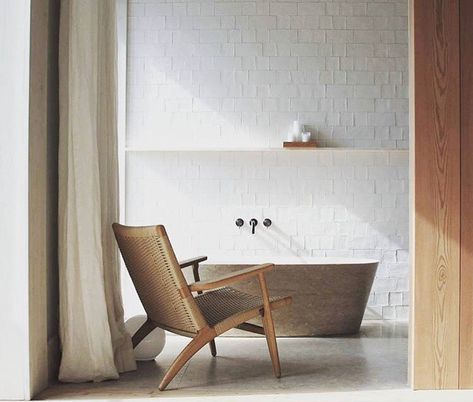 Sundays - minimal bathroom #mutedtones #whitespace #minimaldesign #midcentury #openshelving #ch25chair #hansjwegner #scandinaviandesign #danishdesign #functionalism Bathroom Limestone, Ch25 Chair, Limestone Bathroom, White Linen Sheets, Limestone Floor, Living Photography, Minimal Bathroom, Limestone Flooring, Downstairs Bathroom