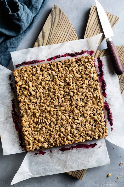 Healthy breakfast oatmeal jam bars filled with homemade berry chia jam or your favorite store-bought jam. Sweetened with only a hint of coconut sugar and maple syrup. These cozy berry crumble bars are made with whole grain oat flour, mildly sweet sorghum flour, and rolled oats! #oatbars #oatmealjambars #oatmeal #chiajam #berries #berryjam #recipe #breakfast #healthy #gluten-free #oats #sorghumflour Oatmeal Jam Bars, Healthy Breakfast Oatmeal, Oat Bars Healthy, Berry Crumble Bars, Oatmeal Bars Healthy, Oat Flour Recipes, Jam Bars, Bars Healthy, Healthy Oatmeal Breakfast